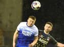 Charlie Hughes wins another header against Coventry