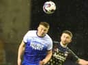 Charlie Hughes wins another header against Coventry