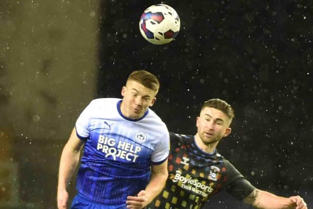 Charlie Hughes wins another header against Coventry