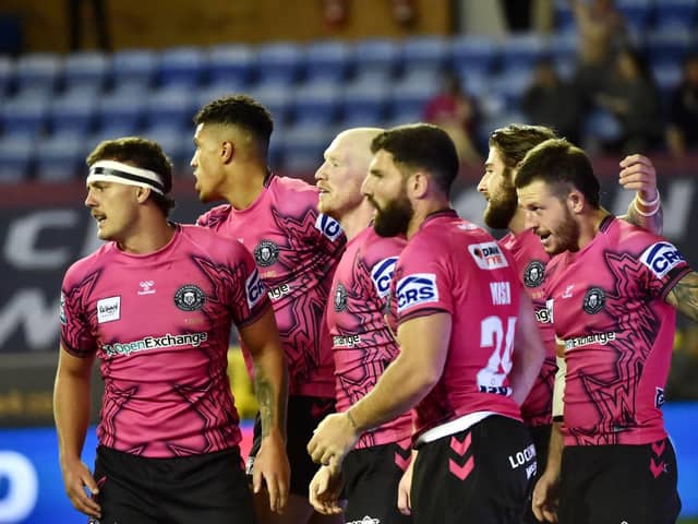 Abbas Miski celebrates with his Wigan Warriors teammates