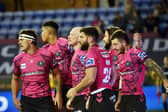 Abbas Miski celebrates with his Wigan Warriors teammates