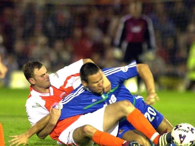 Ged Brannan gets stuck in during his time with Latics