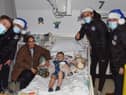 Callum Lang, Jamie Jones, Thelo Aasgaard and Mal Brannigan meet one of the patients
