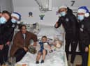 Callum Lang, Jamie Jones, Thelo Aasgaard and Mal Brannigan meet one of the patients