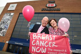 Cancer survivor Angela Ratcliffe, known on social media as Wig-on-Her, as she put on a variety of wigs during her Cancer treatment, pictured with her dad Chris Rimmer, outside the DW Stadium, Wigan, where she will host her Pink Party, an evening of fun and fund raising, with a three-course meal, entertainment and an auction, on Saturday March 2, for the Breast Cancer Now charity