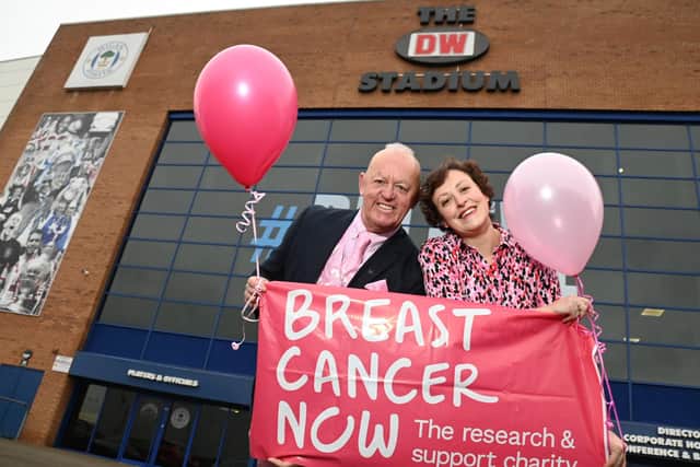 Cancer survivor Angela Ratcliffe, known on social media as Wig-on-Her, as she put on a variety of wigs during her Cancer treatment, pictured with her dad Chris Rimmer, outside the DW Stadium, Wigan, where she will host her Pink Party, an evening of fun and fund raising, with a three-course meal, entertainment and an auction, on Saturday March 2, for the Breast Cancer Now charity