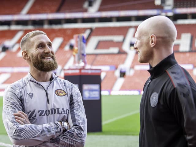 Catalans Sam Tomkins talks to old team mate, Wigan's Liam Farrell inside Old Trafford on Thursday
