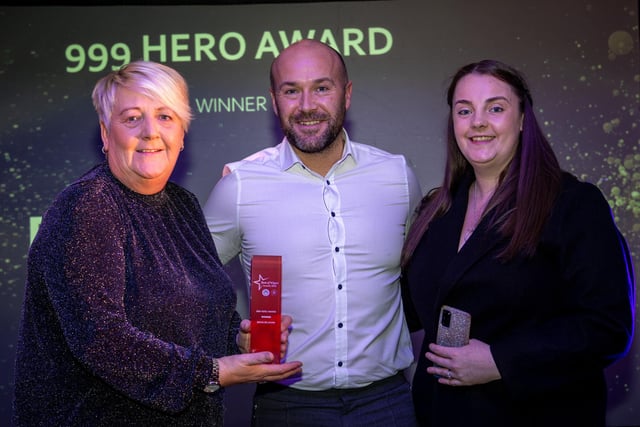 999 Hero Award. Lisa and Danielle Belshaw receive the award on behalf of Brian Belshaw