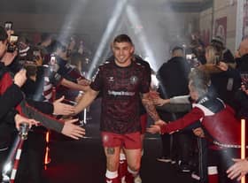 Sam Powell led the Wigan Warriors players through the Robin Park Arena fan zone ahead of the warm-up.