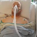 Neil recovering from his operation in hospital