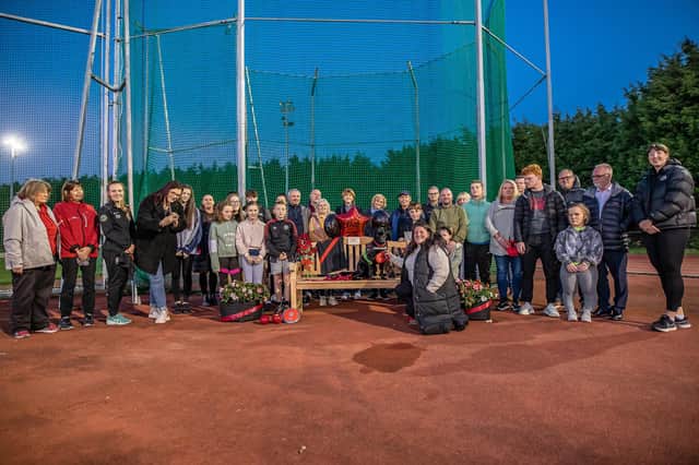 Members of Bob's family and Wigan Harriers at the bench unveiling