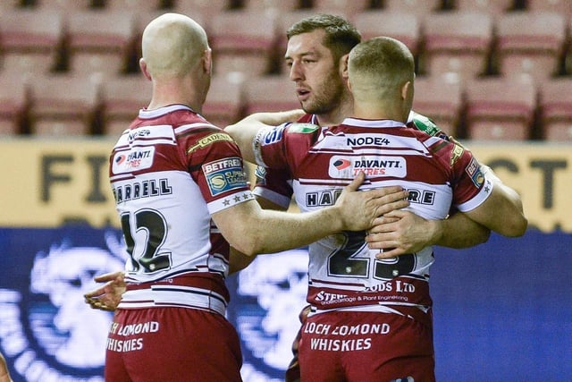 Wigan Warriors claimed a 44-18 win over Sheffield Eagles to progress in the Challenge Cup