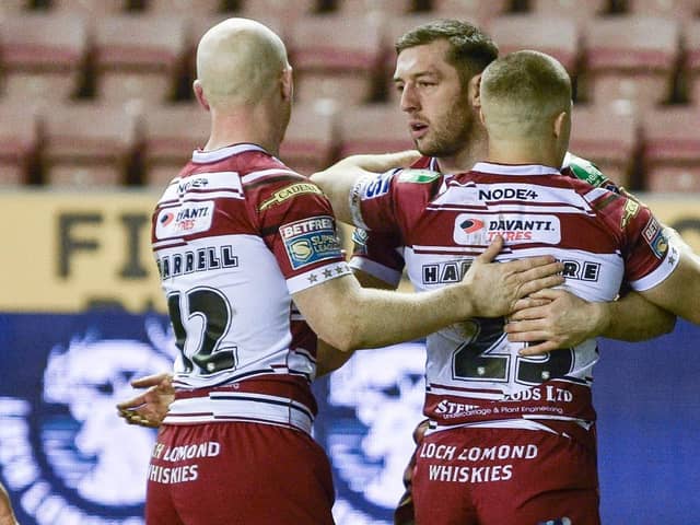 Wigan Warriors claimed a 44-18 win over Sheffield Eagles to progress in the Challenge Cup