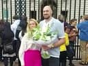 Video grab of Tyson Fury laying flowers down outside Buckingham Palace