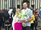 Video grab of Tyson Fury laying flowers down outside Buckingham Palace
