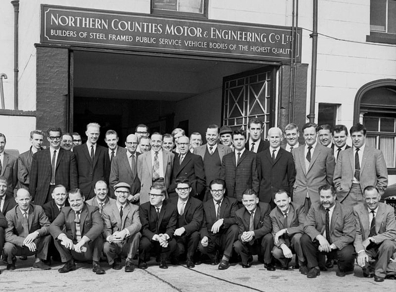 Workers from Northern Counties on Wigan Lane gather ready to set off on a day trip in the 1960s.