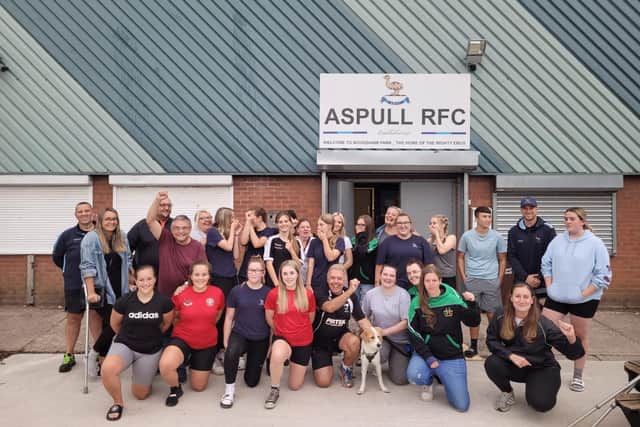 Members of Aspull RUFC celebrate with ward councillors