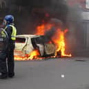 A car burns on Parliament Road, in Middlesbrough, during an anti-immigration riot. Credit: Owen Humphreys/PA Wire