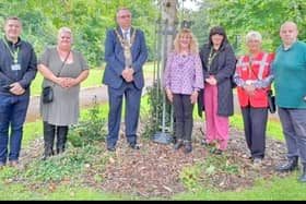 The Firs Park unveiled ceremony featuring Wigan Mayor Kevin Anderson and Jean Hensey-Reynard (centre)