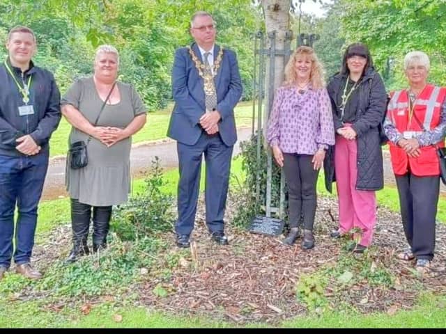 The Firs Park unveiled ceremony featuring Wigan Mayor Kevin Anderson and Jean Hensey-Reynard (centre)