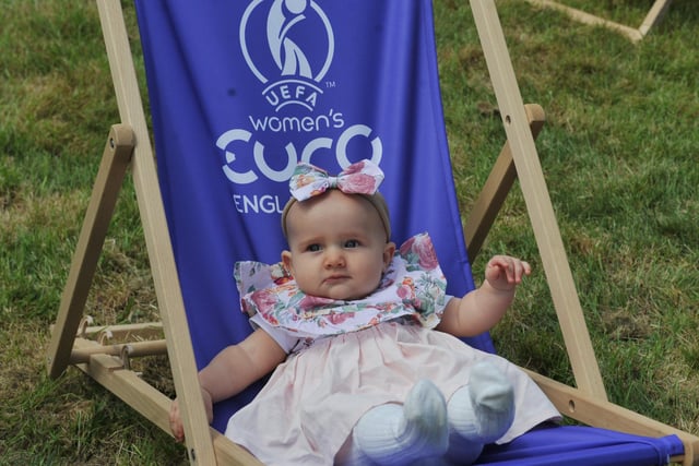 Aurora Leigh, seven-months-old, has fun. 
Family fun at children and adults take part in the interactive workshops at the Women's Euro 2022 Roadshow, held at Mesnes Park, Wigan.