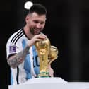 Lionel Messi with the World Cup