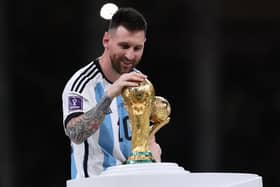 Lionel Messi with the World Cup