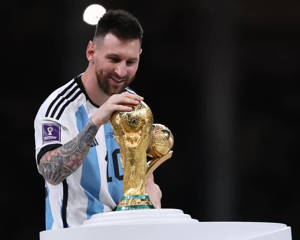 Lionel Messi with the World Cup