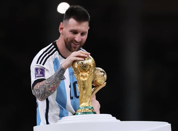 Lionel Messi with the World Cup