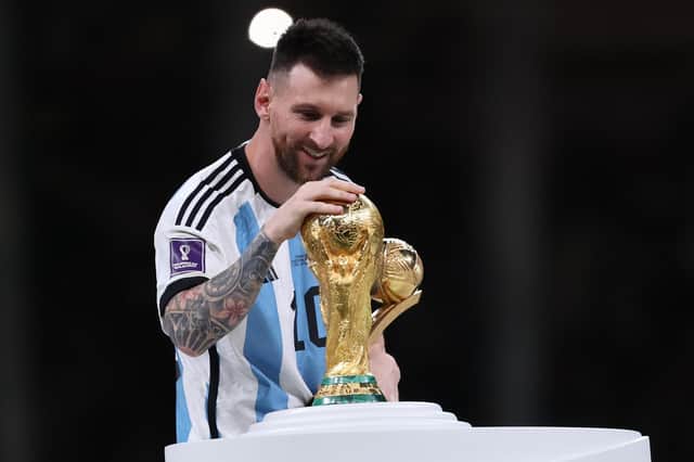 Lionel Messi with the World Cup