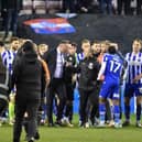 Shaun Maloney gets in between Latics winger Martial Godo and Bolton boss Ian Evatt after the derby earlier this month