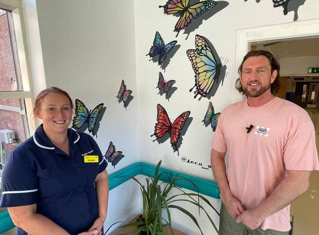 Emma Stoddard (Ward Manager) and Christian Fenn, in front of a new butterfly mural at Blackpool Victoria Hospital designed to inspire hope.