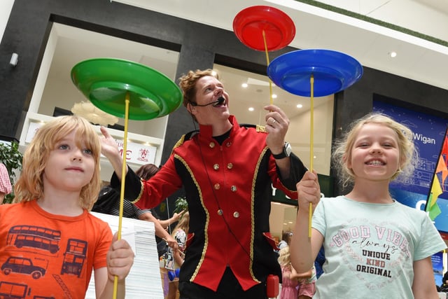 Lloyd Warbey, actor and former presenter of Art Attack,  teaching circus skills to Flynn Taylor, five, and Lois Taylor, right.
