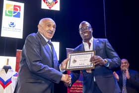 Billy Boston MBE presents Martin Offiah MBE with his Rugby League Lions Association heritage certificate