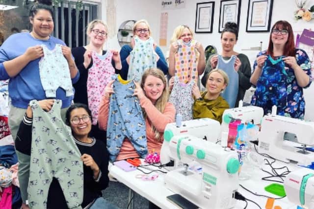 The This Mummy Sews group with some of the clothing they have created