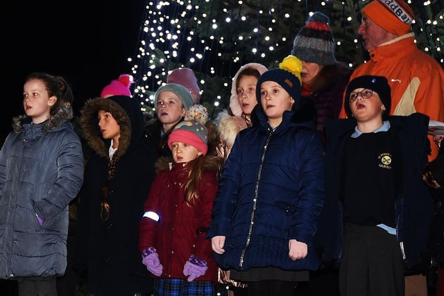 A choir with pupils from four local primary schools performs at the service