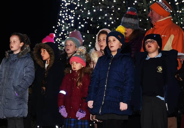 A choir with pupils from four local primary schools performs at the service