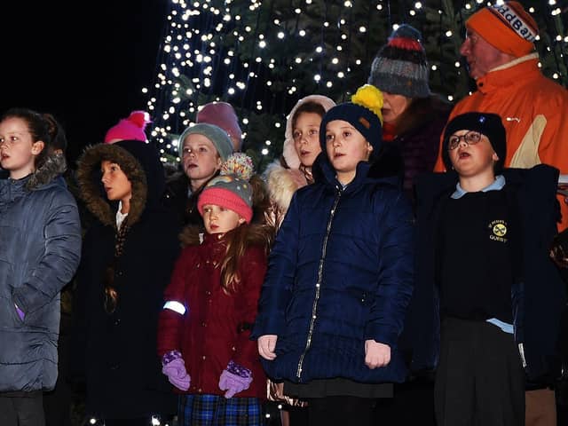 A choir with pupils from four local primary schools performs at the service