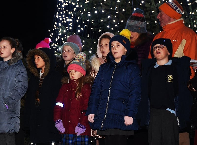 A choir with pupils from four local primary schools performs at the service