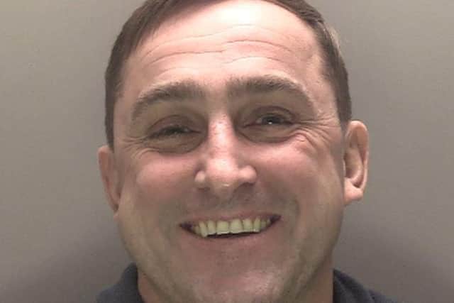 John Rasburn is now behind bars