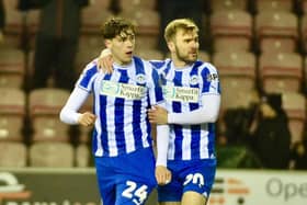 Callum McManaman congratulates Luke Chambers after his equaliser against Cheltenham