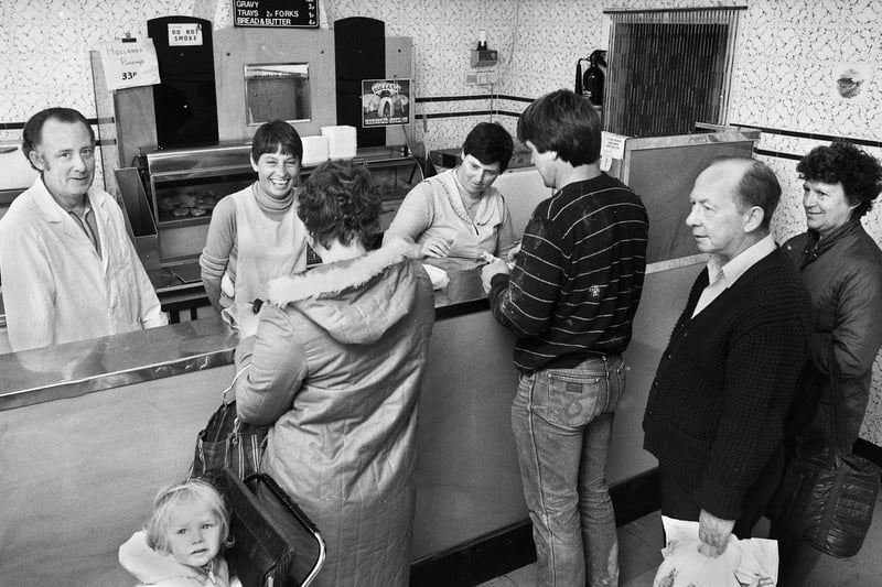 Derek Holliday and staff in his chippy in Gidlow Lane, Wigan, in September 1983.