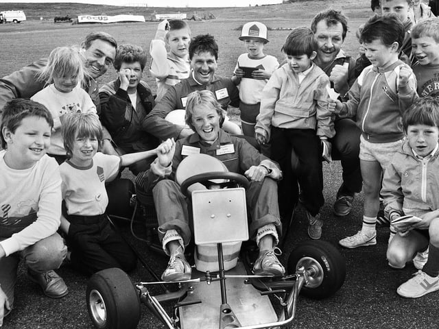 Television and sporting stars enjoy a karting session with Wigan schoolchildren at a charity triathlon in aid of the Adventure Farm Trust at the Three Sisters race track on Wednesday 18th of May 1988. On board is Coronation Street's Sally Webster (Actress Sally Whittaker) with footballer Ian St. John, Crackerjack presenter Stu Francis and rugby union star Bill Beaumont