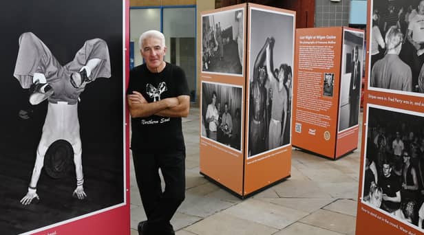 Photographer Francesco Mellina (pictured)  next to his exhibition, Last Night at the Casino, photographs of the last Northern Soul night at Wigan Casino in 1981.
