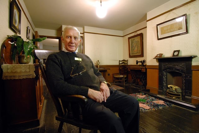 Volunteer Roy Ganderton gets comfy in a Victorian living room.