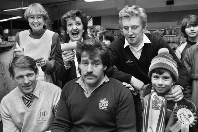 Wigan Rugby League players Graeme West, Danny Campbell and Shaun Edwards have their hair cut and styled at a promotional event at Debenham's store in Wigan on Saturday 16th of March 1985.