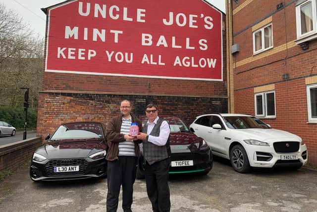 Songwriter Chris Winnard (left) with John Winnard outside the Uncle Joe's Mint Ball factory