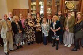The Reverend Alison Brown and volunteers receive the Heart of the Community award from mayor Coun Debbie Parkinson and Coun Pat Draper