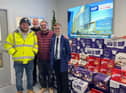 Left to right: Charlie's dad, Ben Heslin, Vinci Construction staff members and Charlie Heslin, 11.
