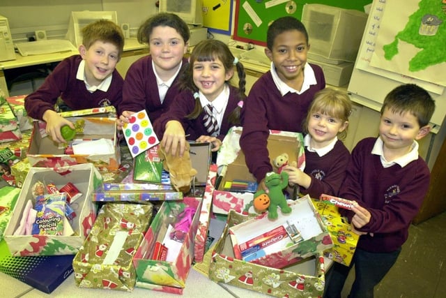 Pupils from Parbold Douglas with some of the charity shoebox collections.